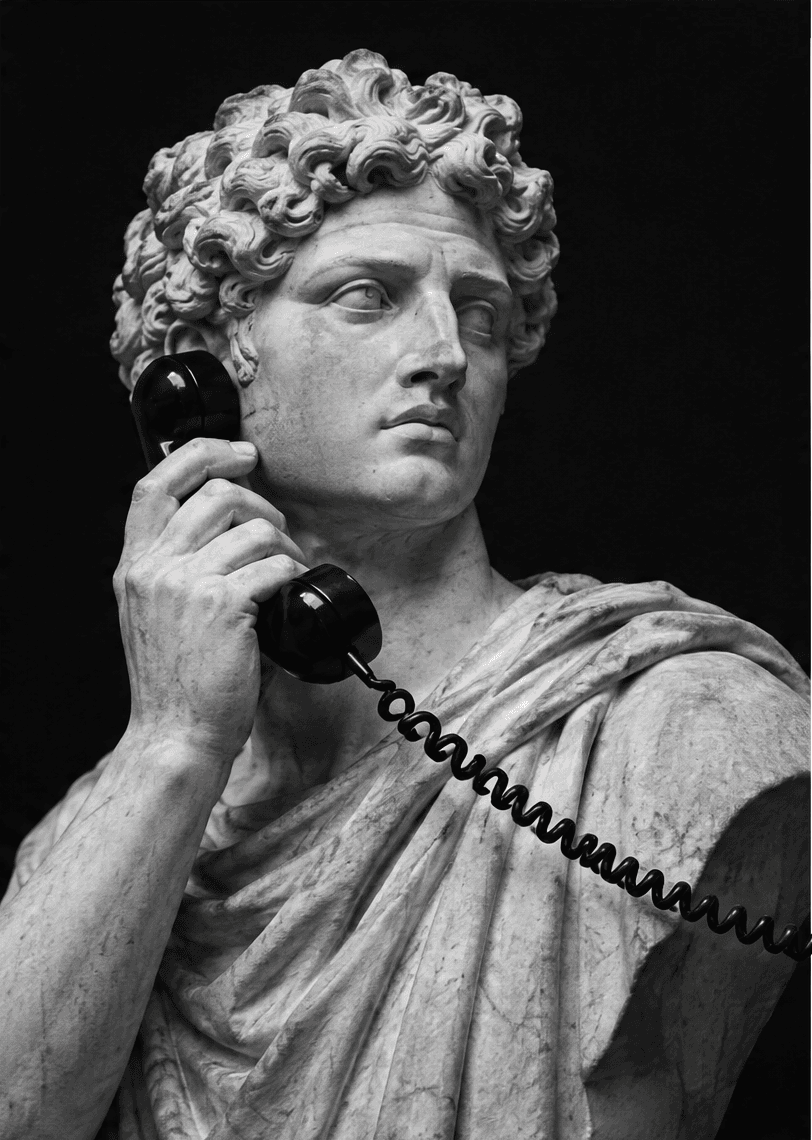 A marble bust in the Renaissance manner holding a telephone handset, its coiled cord looping out of the frame.