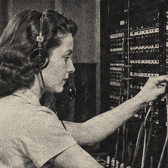 A 1950s switchboard operator in a headset, plugging a cable into a wall of sockets.